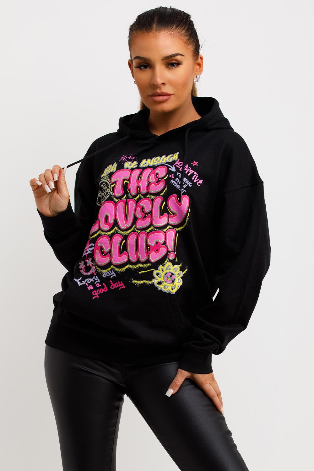 womens black oversized hooded sweatshirt with graphic slogan