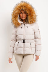 womens winter coat with faux fur hood and belt styled up 