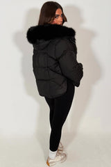womens black fur hood puffer jacket with fur trim on the front styledup