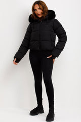 womens black puffer jacket with faux fur hood for winter