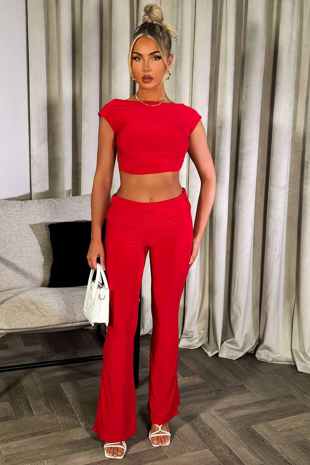 skinny flare trousers with fold over detail and backless crop top co ord set going out summer occasion outfit