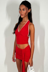 halterneck top with crochet trim and mini drape skirt co rod set red