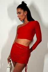 red ruched mini skirt and one shoulder long sleeve crop top co ord festival summer holiday outfit