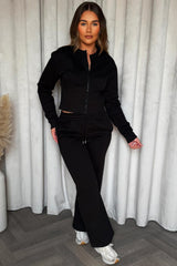 zip up crop sweatshirt corset detail and joggers tracksuit co ord set styledup airport travelling outfit 