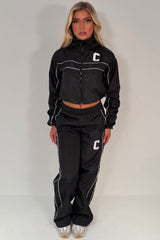 funnel neck jacket and track trousers tracksuit two piece co ord set womens summer holiday outfit 