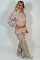 beige crop funnel neck jacket and wide leg trousers tracksuit holiday festival rave outfit styledup uk