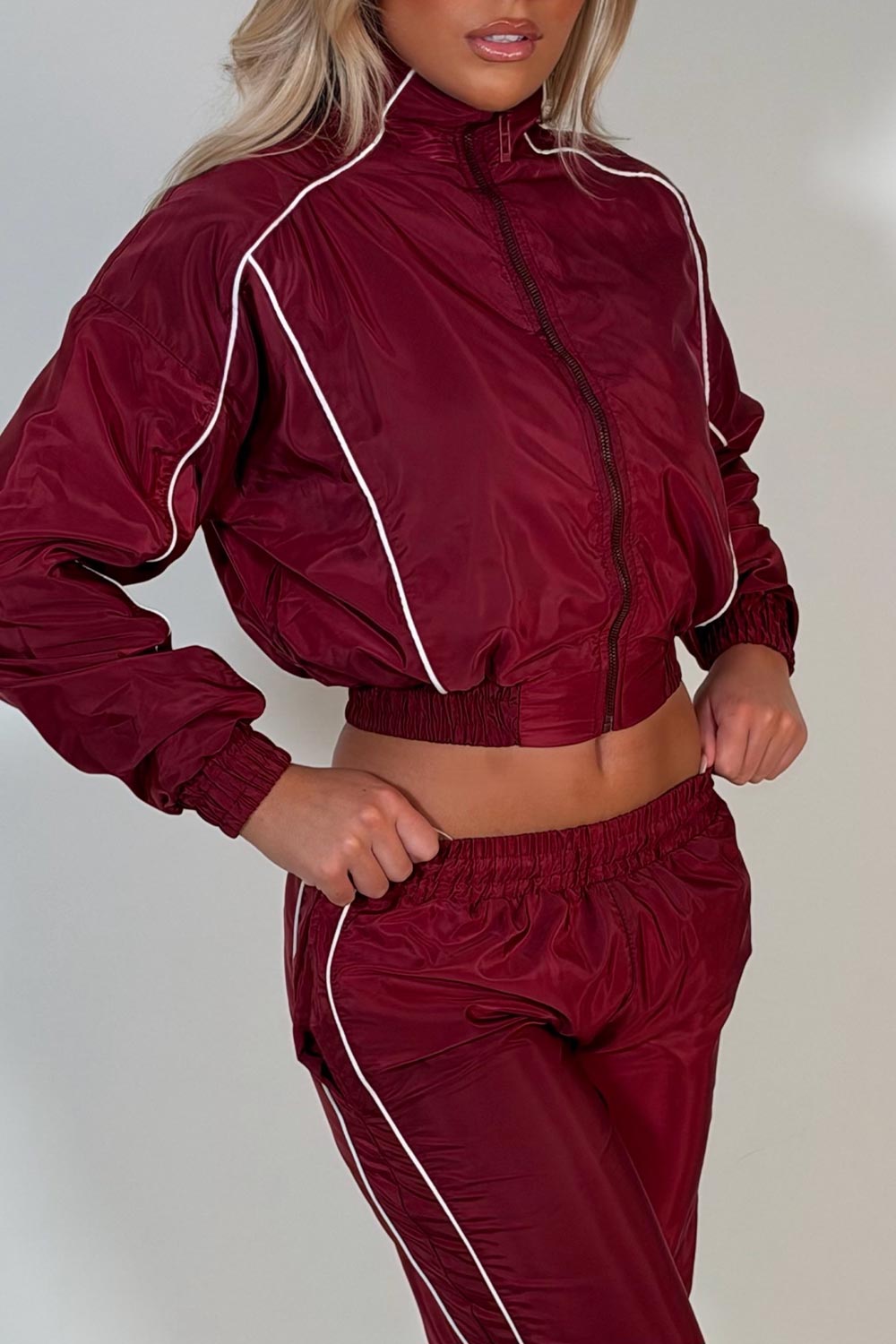 burgundy crop funnel neck jacket and wide leg trousers tracksuit holiday festival rave outfit styledup uk