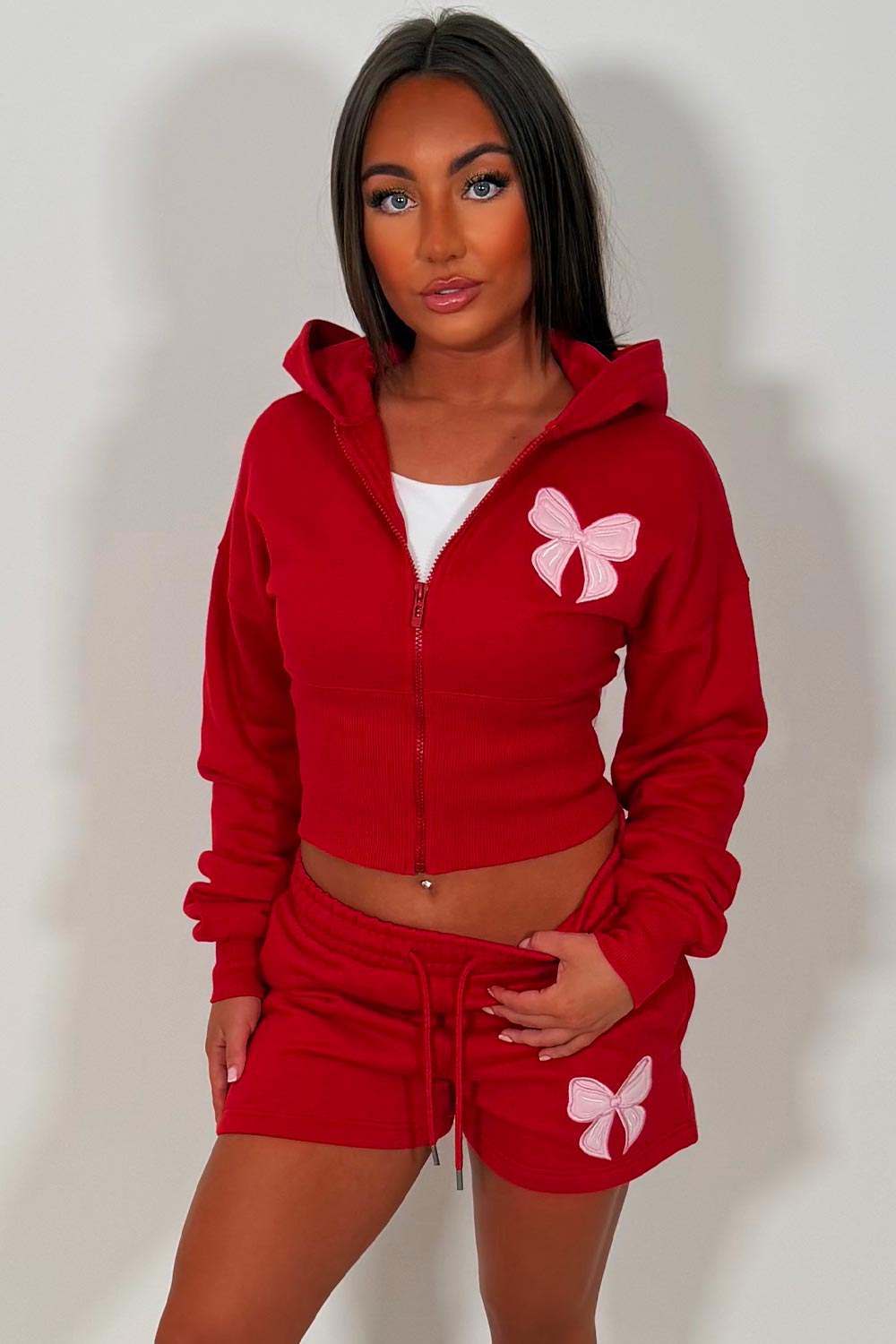 womens cinched waist crop corset hoodie and shorts tracksuit bow detail airport outfit co ord 