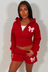 womens cinched waist crop corset hoodie and shorts tracksuit bow detail airport outfit co ord 
