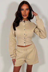crop button up sweatshirt with cinched waist and shorts tracksuit two piece co ord set airport outfit whitefox uk styledup