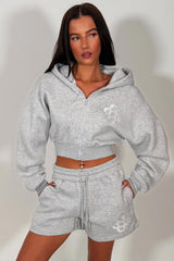 crop hoodie with cinched waist and shorts tracksuit two piece co ord set airport outfit womens uk