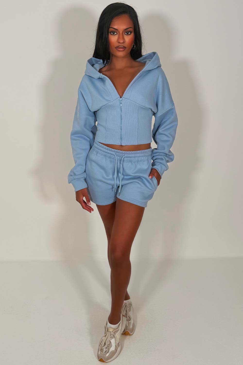 crop hoodie with cinched waist and shorts tracksuit two piece co ord set airport outfit