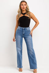 halter neck gold buckle going out top black bodysuit styled up