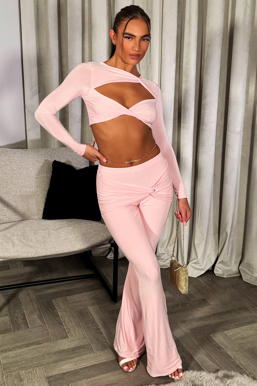 pink flare double lined trousers and long sleeve crop top with twist detail going out festival rave summer holiday outfit