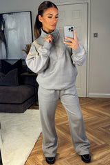 half zip sweatshirt and straight leg joggers tracksuit co ord airport outfit