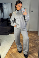 half zip jumper and joggers tracksuit airport outfit