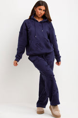 womens distressed cross hoodie and joggers set loungewear styled up