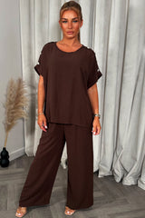 womens oversized top with gold button detail and matching wide leg trousers co ord set christmas party outfit
