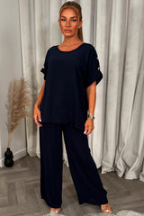 christmas party co ord with gold button shoulder top and trousers outfit for womens