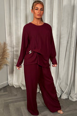 womens black long sleeve top and trousers co ord set with gold buckle 