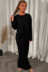 womens black long sleeve top and trousers co ord set with gold buckle 