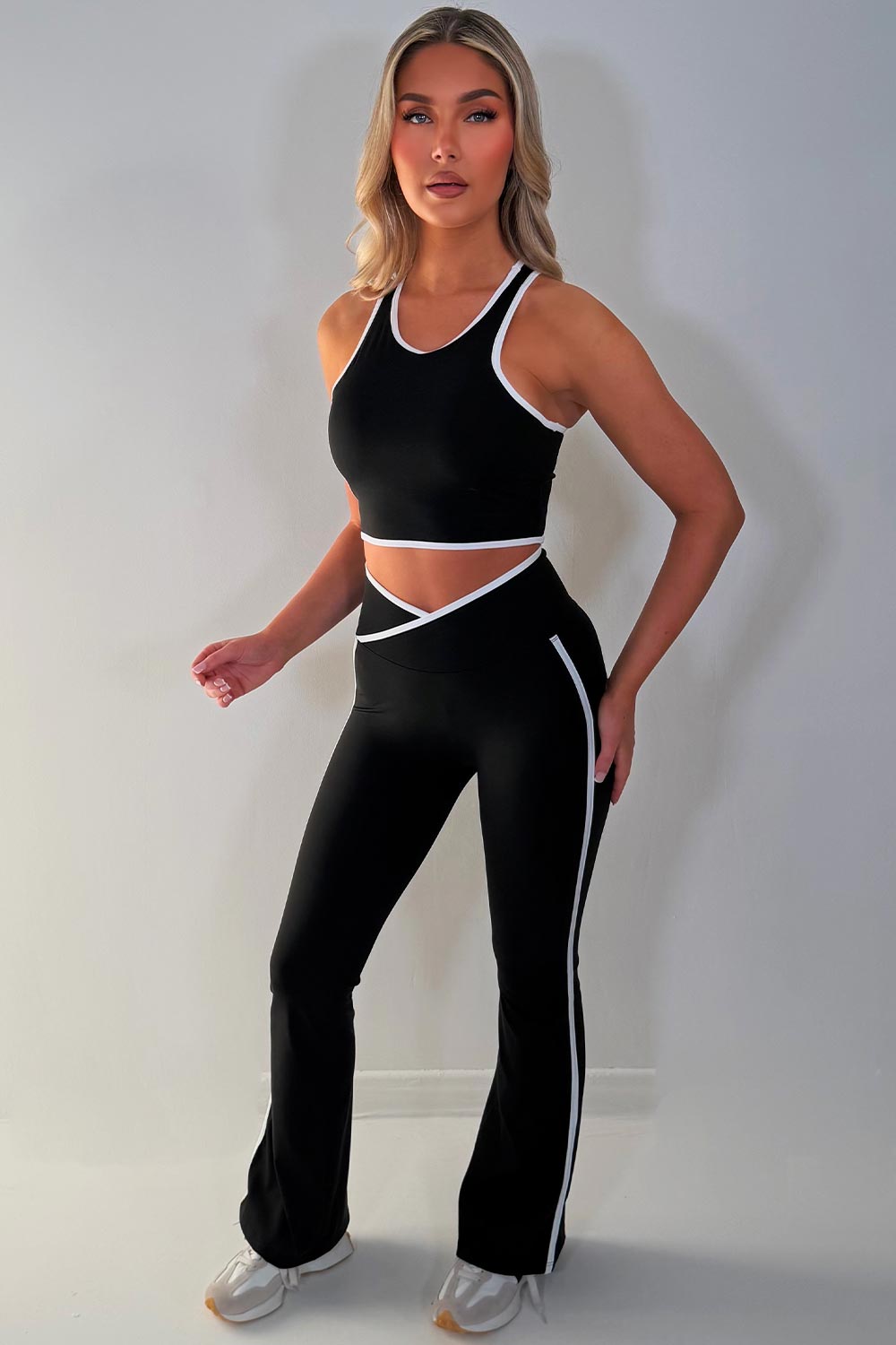 zip up sports jacket crop top and scrunch bum skinny flare pants 3 piece set black