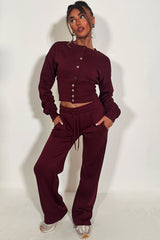 womens button up compress waist crop tracksuit styledup airport outfit travelling clothes styledup 