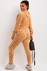 womens velour hooded tracksuit with jadore slogan