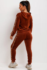 womens velour tracksuit with jadore slogan