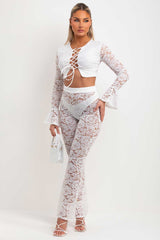 lace flare trousers and long flare sleeve lace up front crop top going out summer holiday festival outfit