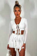 white festival skirt and long sleeve crop top co ord set festival outfit