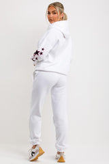 womens white tracksuit zip hoodie and joggers set with teddy bear graphics 