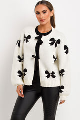 womens knitted jumper with bows and diamante detail