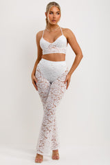 womens skinny lace trousers and top set white