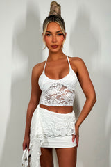 white lace bralet and mini skirt with drape detail two piece co ord set