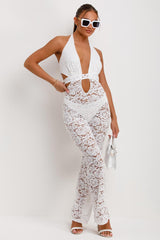 white lace plunge neck jumpsuit with skinny flare legs