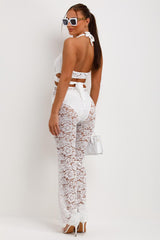 white lace plunge neck jumpsuit with skinny flare legs occasion summer holiday outfit