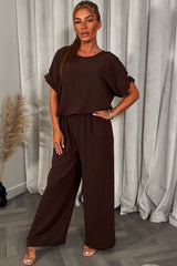 gold button shoulder top and trousers co ord set christmas party outfit