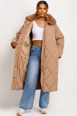 womens long quilted puffer coat with fur collar styled up