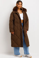 womens long quilted puffer coat with fur collar styled up