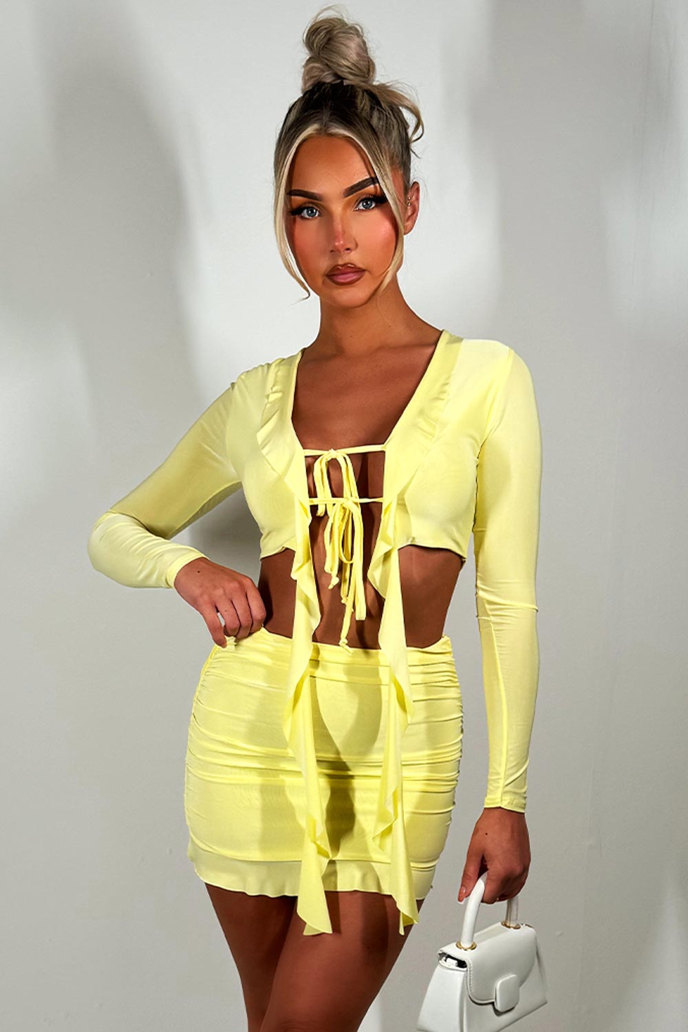 yellow mini skirt and long sleeve tie front frilly crop top set festival going out holiday outfit 