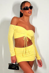 yellow mini skirt and off shoulder long sleeve ruched front crop top two piece festival summer holiday set rave outfit