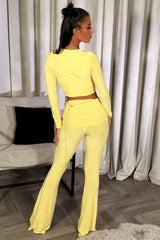 skinny flared trousers with fold over waist and top two piece set yellow going out outfit