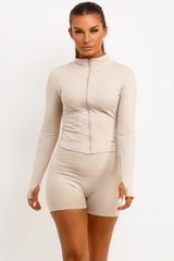 gym shorts and zip up sports jacket two piece set skims women