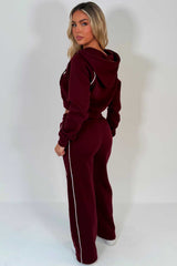 womens burgundy crop hoodie and joggers tracksuit set airport outfit styledup