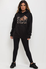 womens black oversized hoodie with teddy bear print and just relax slogan