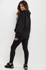 womens black oversized hoodie with just relax slogan