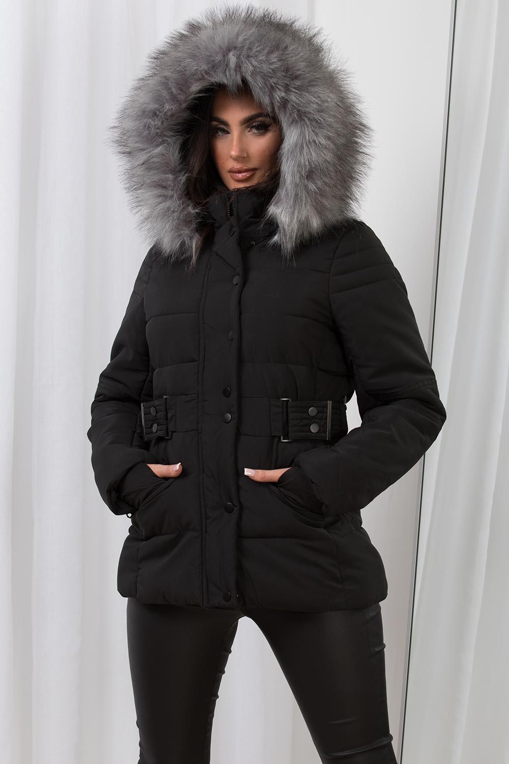 black puffer jacket with faux fur hood and belt