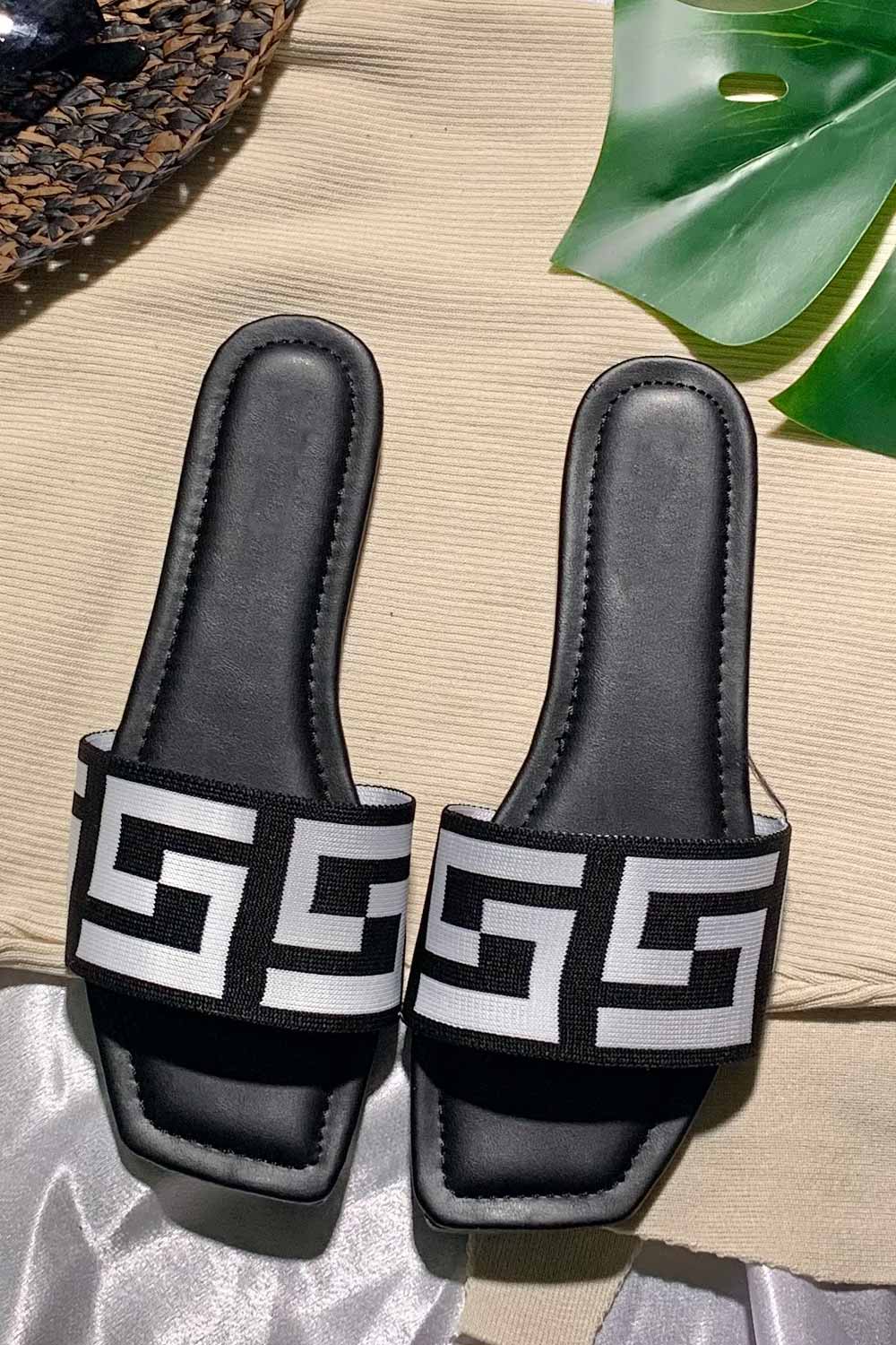 black flat slip on sandals 