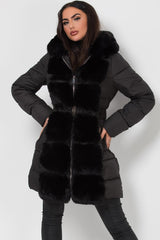 black long puffer down coat with faux fur hood and trim